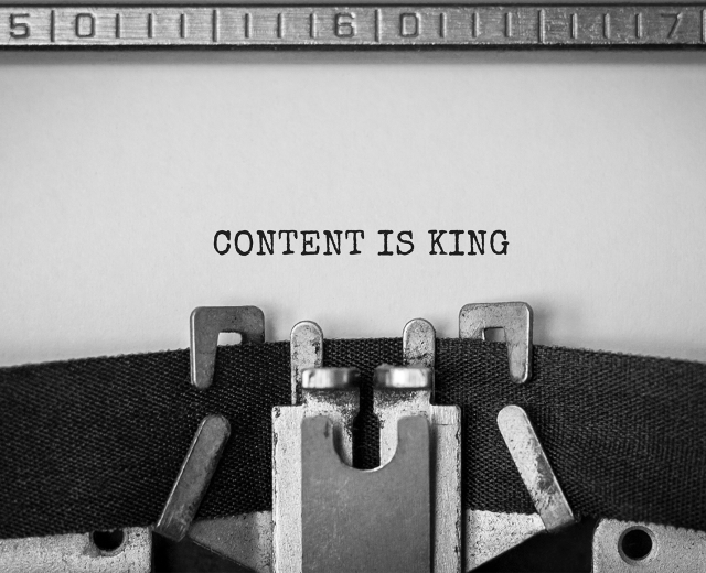 typewriter image saying content is king
